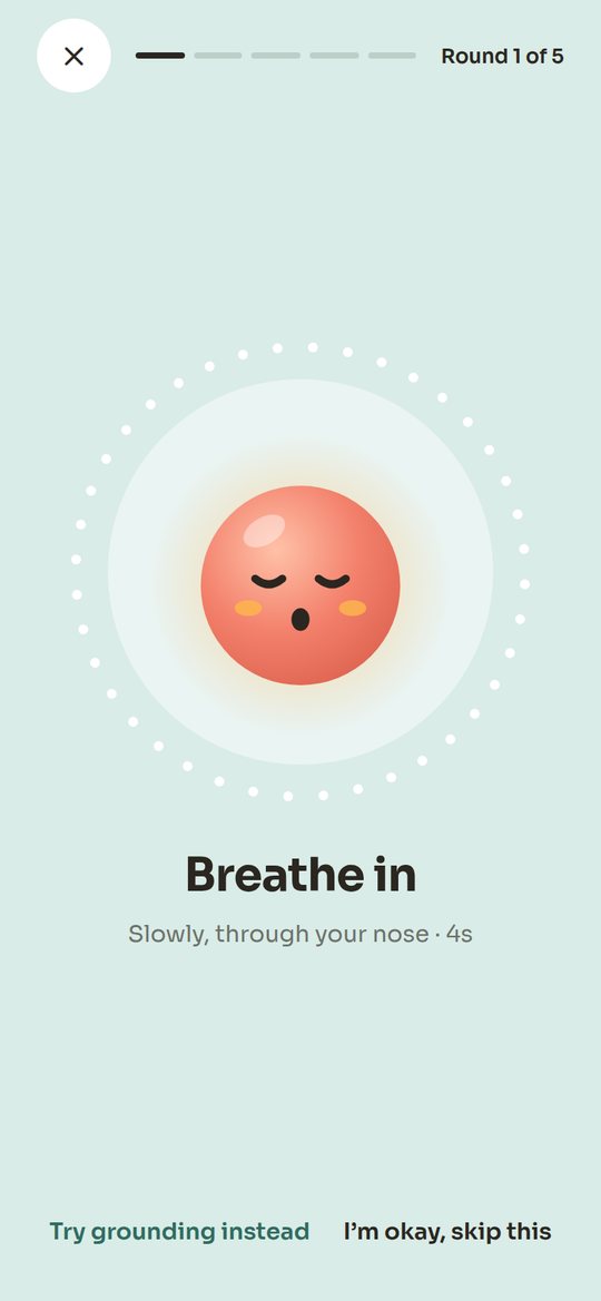 Wacha's SOS screen: a calm breathing guide saying “Breathe in”.